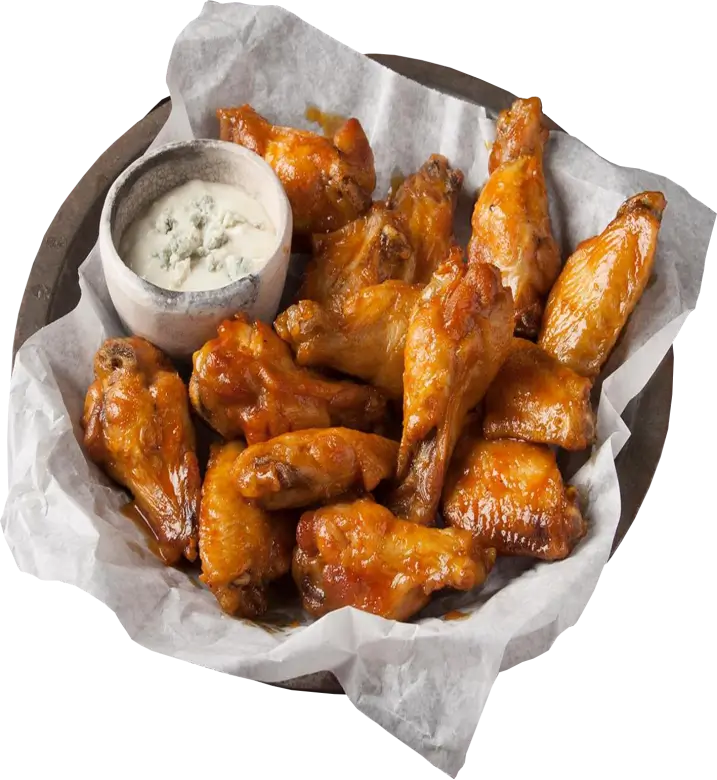 Crispy wings served with creamy cheese dip, presented on a basket lined with a custom-designed food basket liner