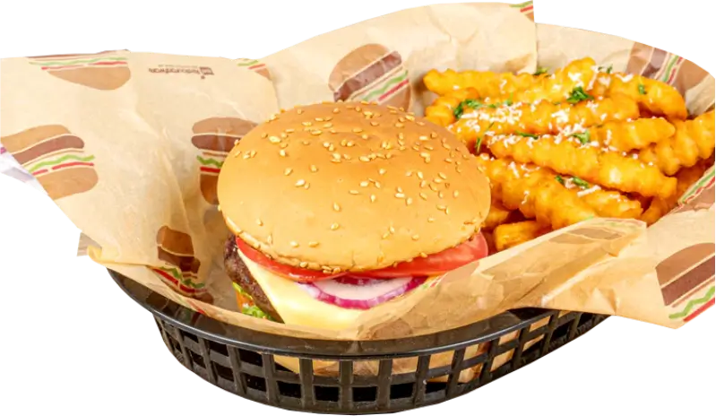 Basket with a sesame seed burger and crinkle-cut fries served on a custom-printed food basket liner featuring burger-themed designs