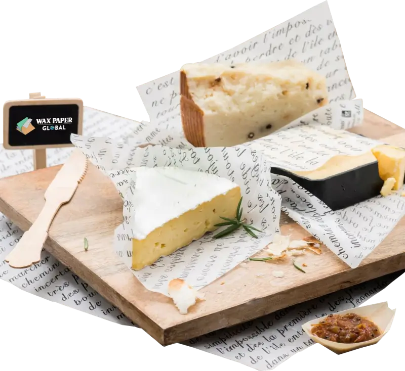 Assorted cheeses wrapped in custom-printed cheese paper featuring elegant script designs, displayed on a rustic wooden board with garnishes