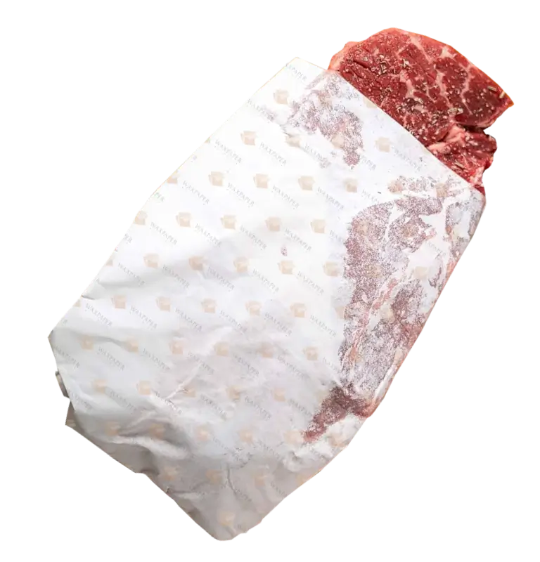 Custom printed freezer paper wrapping a frozen meat piece, featuring the Wax Paper Global logo on the paper