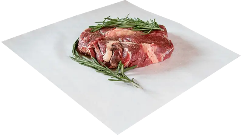 Raw meat cut garnished with fresh rosemary, placed on a custom freezer paper sheet, ideal for preserving freshness and flavor