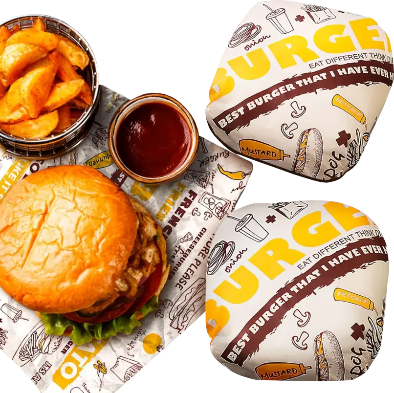 Burgers and wedges served with ketchup, wrapped in custom-printed greaseproof paper featuring vibrant food-themed designs