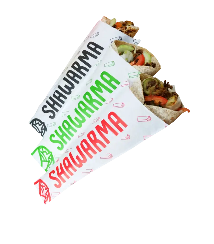 Shawarma wraps in custom-printed greaseproof paper with bold text and colorful designs