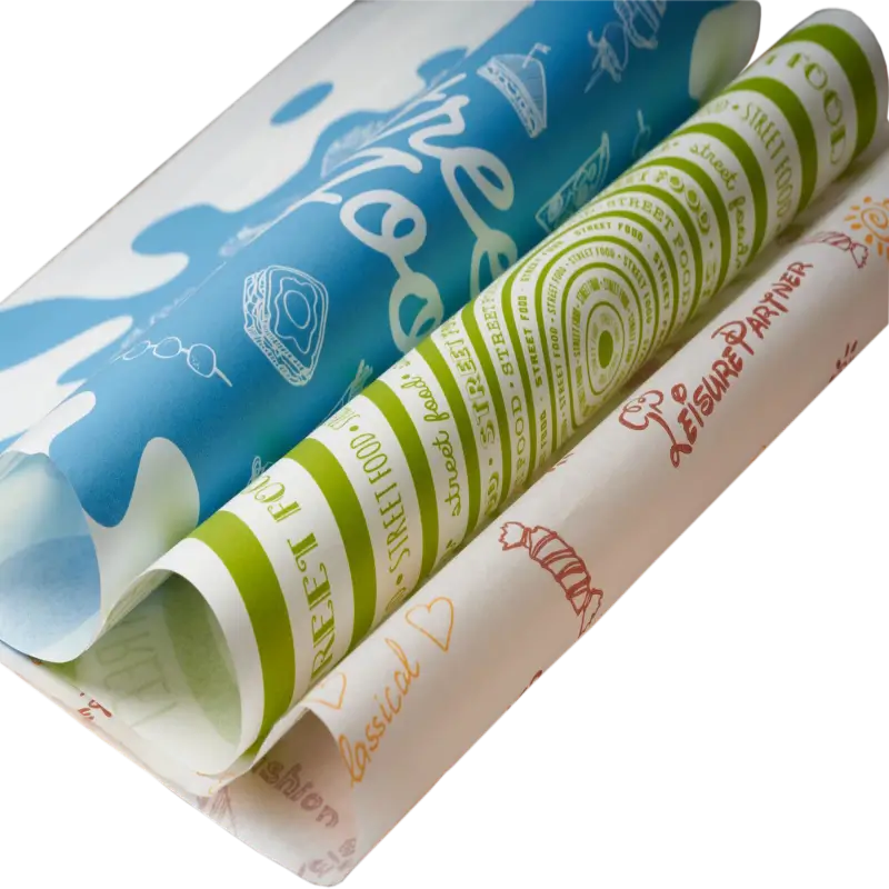 A collection of custom-printed sandwich paper sheets featuring vibrant blue, green, and orange food-themed designs and text patterns