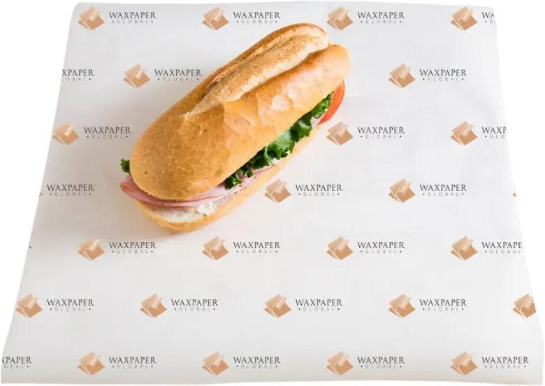 A freshly made sandwich placed on custom-printed sandwich paper featuring the Wax Paper Global logo pattern