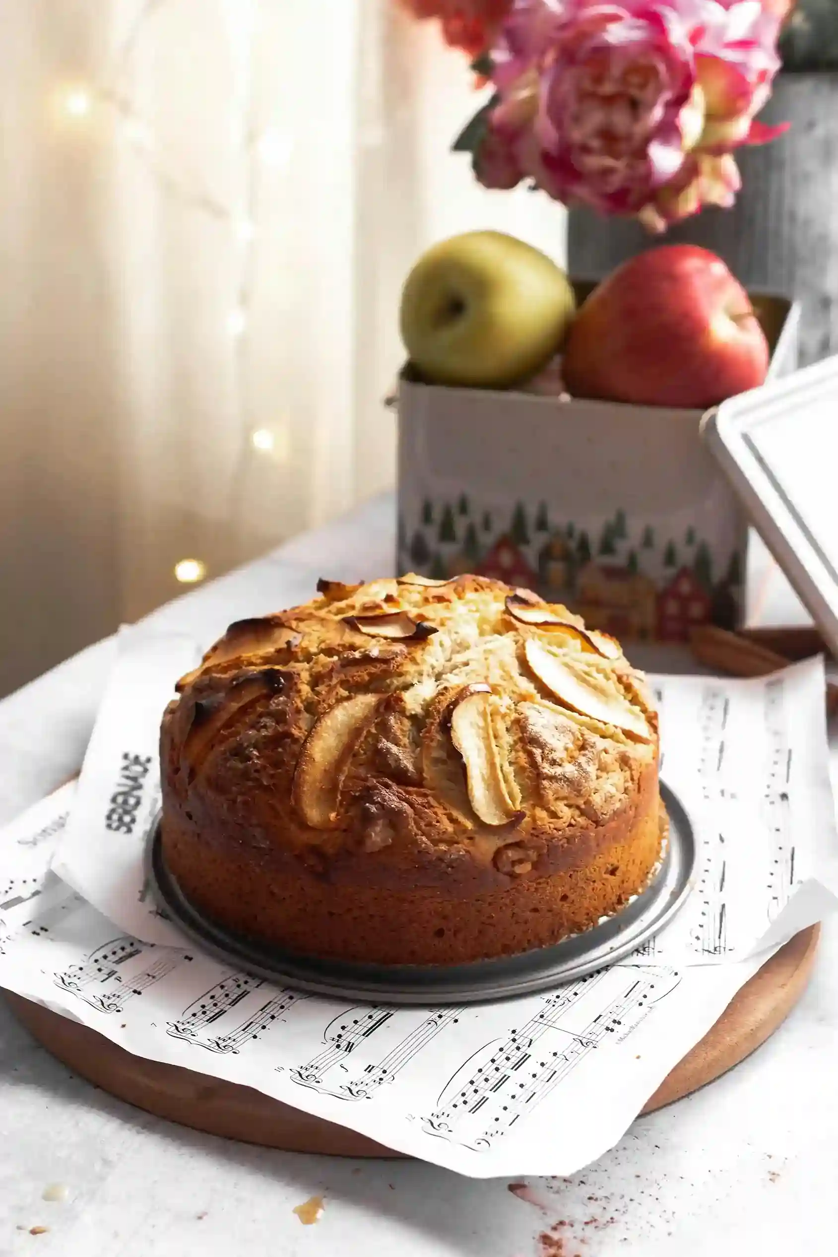 Homemade apple cake on a custom printed wax paper sheet