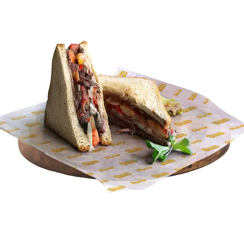Juicy sandwiches lined with custom printed deli paper, highlighting branding and grease resistance properties